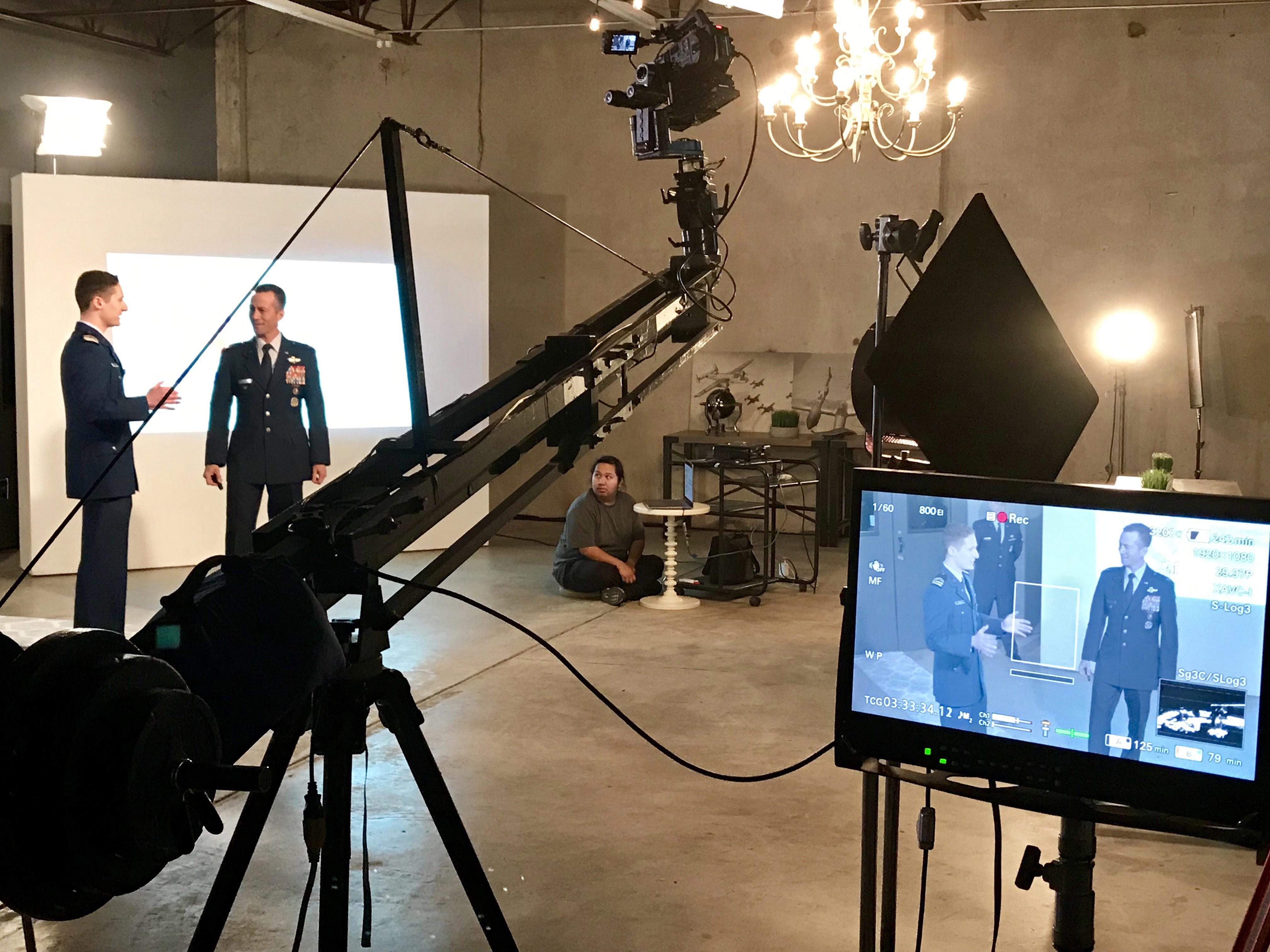 Two Airman being filmed in sound studio